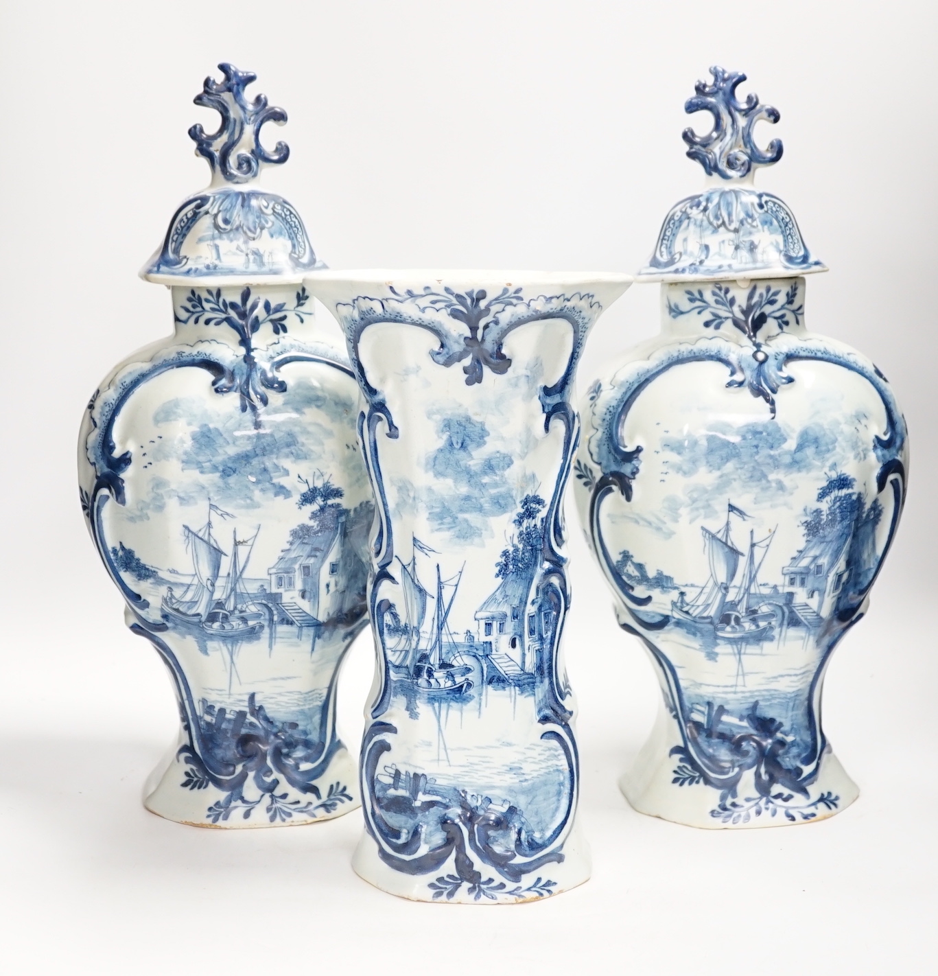 A Delft garniture of three vases, c.1770, tallest 41cm high